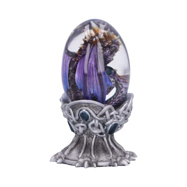 A small purple and gold dragon encased in a clear glass egg on a silver claw stand.