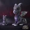 Cult Cuties Dragon Figurines Set - Purple Black Gothic Accents Two cute purple and black dragon figurines with gothic horns and pentagram accents on a dark background.