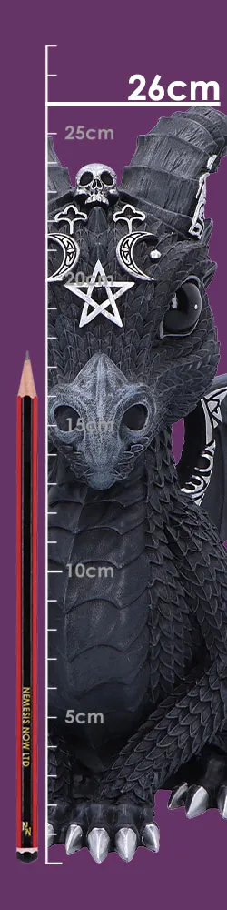 A small black gothic dragon figurine with silver details beside a red-and-black pencil on purple.