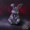 Gothic Bunny Figurine Resin Black With Pentagram And Skull Collar A black gothic bunny figurine with a silver pentagram and skull collar on a dark purple background.