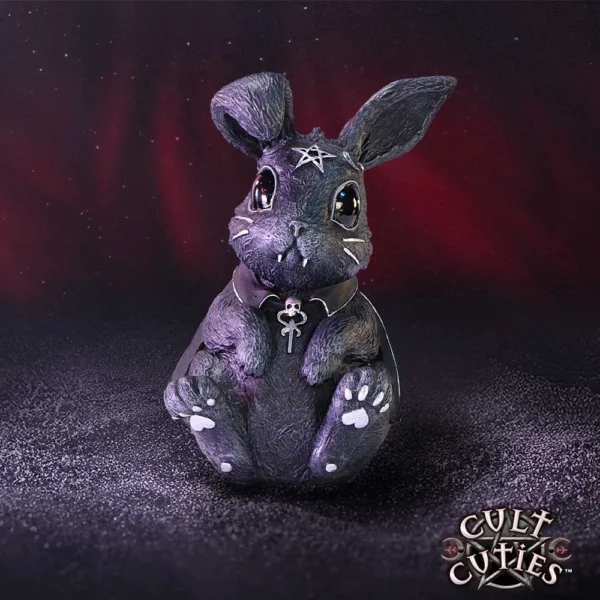 Gothic Bunny Figurine Resin Black With Pentagram And Skull Collar A black gothic bunny figurine with a silver pentagram and skull collar on a dark purple background.