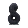 Serpentine Infinity Sculpture Matte Black - Detailed Scaled Design Black serpentine infinity sculpture with detailed scales on a rocky gray-blue base.