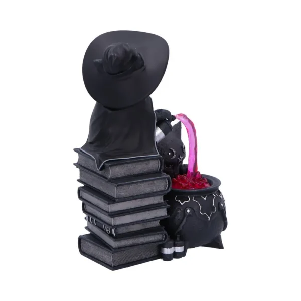 Black Cat Witch Figurine Resin Sculpture - Glowing Cauldron Magic A black cat figurine wearing a witch hat mixing potion in a glowing cauldron on books.