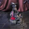 Two black cats brewing pink magical potion in a gothic cauldron with spellbooks and occult symbols.