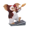 Gizmo Mogwai Figurine Resin Brown Heroic Pose With Fiery Arrow Gizmo figurine aiming a fiery arrow while standing on a metal grate. The-Hidden-Hatch