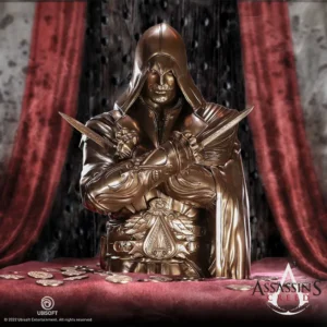 Assassin's Creed Ezio Bronze. Auditore statue with crossed hidden blades on red velvet, Assassin’s Creed collectible.