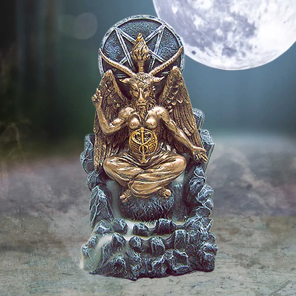 Bronze and gold statue of Baphomet seated on a rocky throne under a glowing full moon.