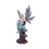 Fairy Figurine Resin Sculpture Lavender Gown With Blue Dragon A fairy figurine in a lavender gown sitting on a tree stump with a small blue dragon.