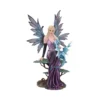 A purple fairy figurine sitting with a small blue dragon on a nature-inspired base.