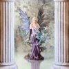 Lavender Fairy Figurine Resin Sculpture - Turquoise Dragon Accent A lavender fairy figurine holding a turquoise dragon between marble columns on a reflective surface.