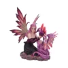 Fairy figurine kneeling beside a small purple dragon on a rocky base.