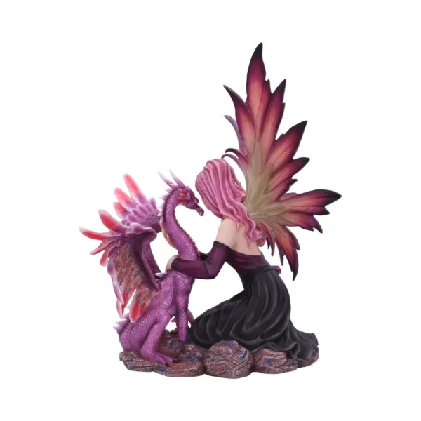 A pink-haired fairy kneeling beside a small purple dragon figurine on a rocky base.