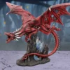 Red Dragon Figurine Resin Statue - Crimson Scales With Crystals A red dragon statue perched on rocky base with glowing blue crystals.