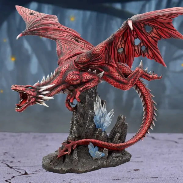 Red Dragon Figurine Resin Statue - Crimson Scales With Crystals A red dragon statue perched on rocky base with glowing blue crystals.