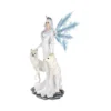 Winter Goddess Figurine Resin Statue White Wings And Wolves A white-winged winter goddess figurine with two white wolves on an icy base.