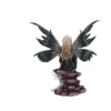 Blonde Fairy Figurine Resin Sculpture - Black Teal Wings A blonde fairy figurine with black and teal wings sitting gracefully on stacked rocks.