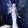 Ice Fairy Figurine Resin Sculpture Blue - With Black Dragon An ice fairy figurine with icy-blue wings holding a black dragon on a blue velvet background.