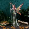 Autumn Fairy Figurine Resin Sculpture - Green Gown & Leaf Wings A detailed fairy figurine with autumn-colored wings holding a vine staff amid forest-themed decor.