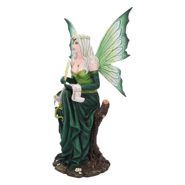 A green fairy figurine with silver hair writing on a scroll while sitting on a tree stump.