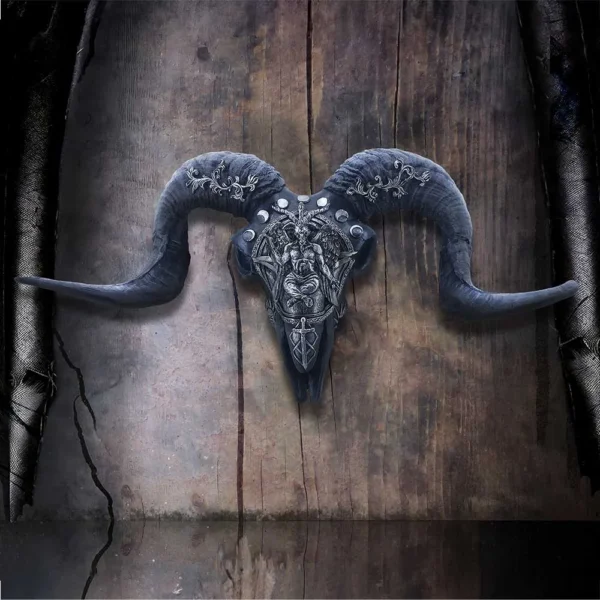 Metal Ram Skull Sculpture Silver Engraved Horns Rustic Wood A metallic ram skull sculpture with engraved horns mounted on aged rustic wooden background.