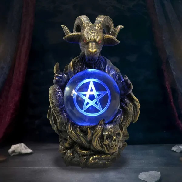 Demonic Goat Statue Bronze Sculpture - Blue Glowing Crystal Orb Dark goat statue holding glowing blue crystal orb with pentagram and skull-carved base.