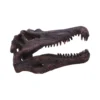 Tyrannosaurus Rex Skull Model Resin Sculpture - Brown Red Fossil A realistic brown-red dinosaur skull model with open jaws and sharp fossil-like teeth.