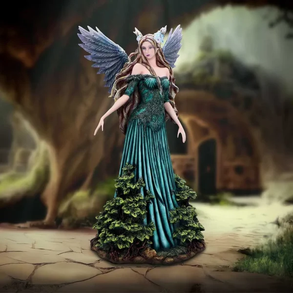Emerald Fairy Figurine Resin Sculpture - Lavender Wings Forest A graceful fairy statue with green gown and lavender wings standing on a forest stone path.