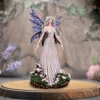 Fairy Figurine Resin Sculpture Blue Iridescent Wings - Floral Base A detailed fairy figurine with iridescent wings standing on a wooden base surrounded by pink flowers.