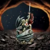 Golden Knight Metal Artwork - Fiery Cave Battle With Dragon A golden-armored knight battles a dark dragon inside a fiery cave.