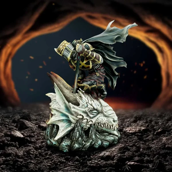 Knight Statue Resin Figure Gold Black - Slaying Petrified Dragon Collector Shelf A kneeling armored knight atop a petrified dragon head in a fiery cavern setting.