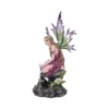 Fairy Figurine Resin Sculpture Mauve Dress Green Purple Wings A delicate fairy figurine with green and purple wings kneeling on a rocky base with flowers.