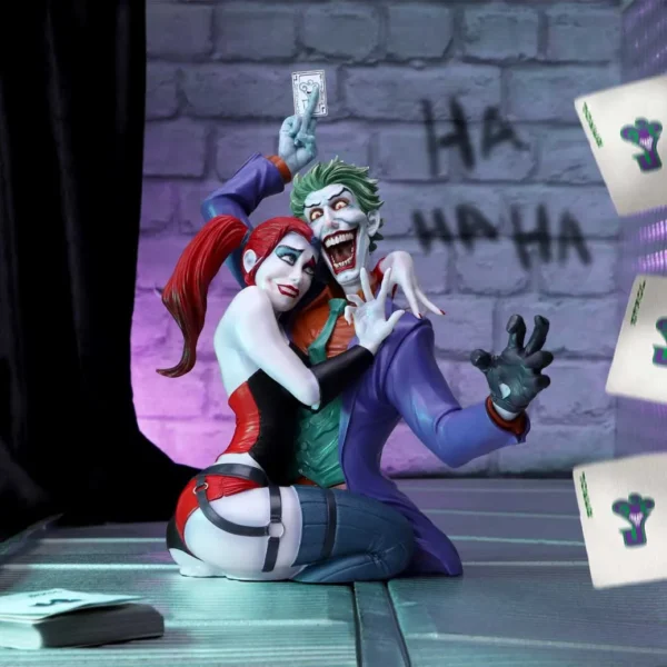 Joker And Harley Quinn Resin Figurine Purple Chaos Display The Joker and Harley Quinn figurine kneeling together amid purple lighting and scattered playing cards.