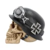 Human Skull Sculpture Resin Beige Black Helmet Iron Cross A beige human skull wearing a black military helmet with silver goggles and an Iron Cross.