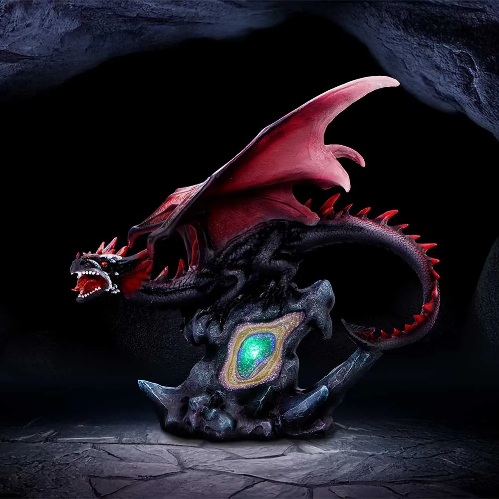 Collectable Home Accessories That Show Character 4 Collectable Home Accessories A black and red dragon statue guarding a glowing green-blue crystal in a dark cave.