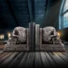 Celtic Skull Bookends Resin Stone Finish - Gothic Library Decor Halloween Gifts: Ornate Celtic skull bookends holding antique leather books on a wooden surface. The-Hidden-Hatch