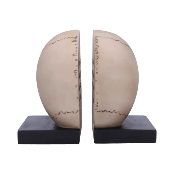 Two cream half-sphere sculptures on black bases resembling modern decorative bookends The-Hidden-Hatch